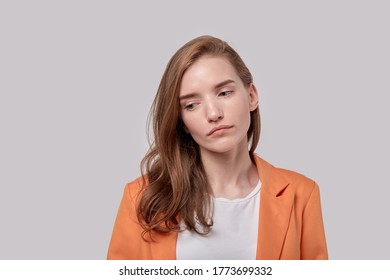 Portrait Of A Young Girl With A Sad Face. Girl Looks Away. Human Emotions.