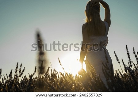 Similar – Hand am Hinterkopf, Frau, Sonnenuntergang