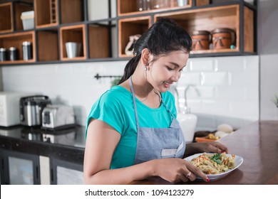 Portrait Of A Young Girl Who Looking Through The Food