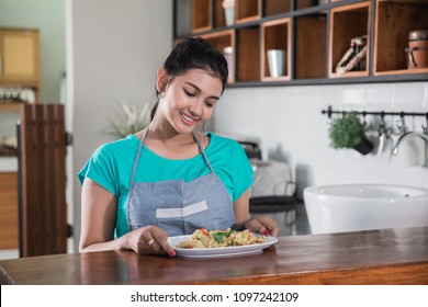 Portrait Of A Young Girl Who Looking Through The Food