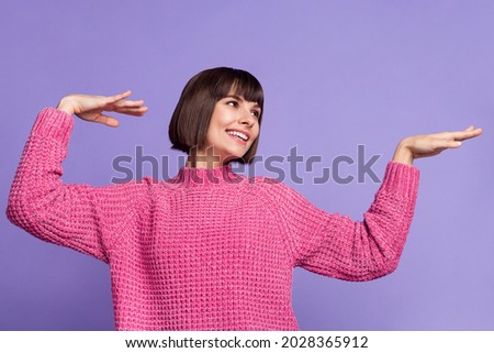 Portrait of young good mood cheerful female dancing look copyspace fooling around isolated on purple color background