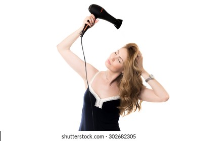 Portrait of young gorgeous blond Caucasian woman using black hair dryer, drying her beautiful long hair, enjoying haircare with closed eyes, studio shot, isolated on white background - Powered by Shutterstock