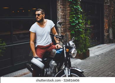 Portrait Young Guy With A Beard And Mustache With Sunglasses And White T-shirt Posing On The Street Vintage Man, Fashion Men, Hipster Street Casual A Motorcycle