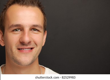 Portrait Of A Young Guy In Front Of A Chalkboard