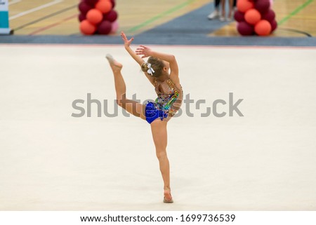 Portrait of a young gymnast. Portrait of a 7 years old girl in rhythmic gymnastics competitions