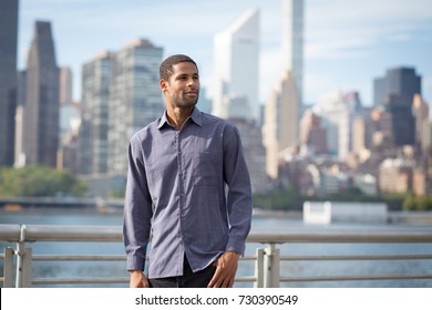 Portrait Of Young Handsome African American Man With NYC Skyline In The Background, Photographed In September 2017