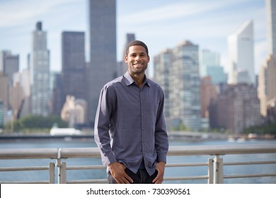 Portrait Of Young Handsome African American Man With NYC Skyline In The Background, Photographed In September 2017