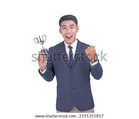 Portrait of a young handsome Asian adult business man in suit, isolated on white background. Concept of a winning competition