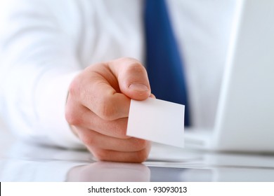 Portrait Of Young Handsome Business Man Holding Blank White Business Card