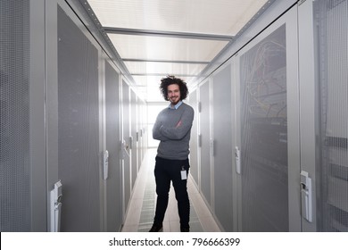 Portrait Of Young Handsome IT Engeneer In Datacenter Server Room