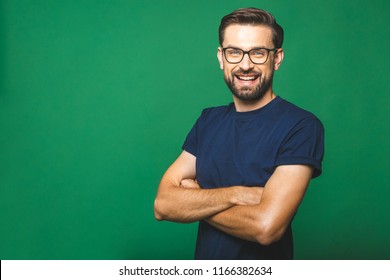 A Portrait Of Young Handsome Man In Casual Isolated On Green Background With Glasses.