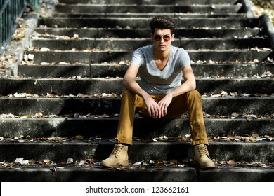 Portrait Of A Young Handsome Man, Model Of Fashion, With Toupee In Stairs