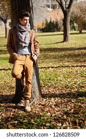 Portrait Of A Young Handsome Man, Model Of Fashion, With Toupee In A Park