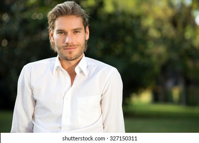 Portrait Of A Young Handsome Man In The Park