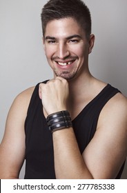 Portrait Of Young Handsome Man Posing In Front Of Camera With Amazing Big Smile But With Missing One Tooth.