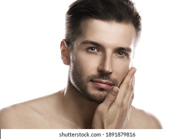 Portrait Of Young Handsome Man With Wet Face After Shower On White Background