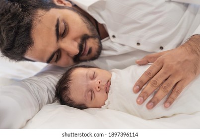 Portrait Of Young Happy Asian Indian Father With His Newborn Baby, Copy Space With Bed In The Hospital Background. Family Love Together Father’s Day Holiday Concept