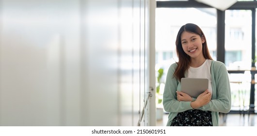 Portrait Of Young Happy Attractive Asian Student Smiling And Looking At Camera. Asian Woman In Self Future Education Or Personalized Learning Concept. Banner