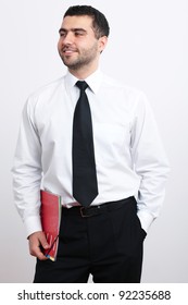 Portrait Of Young Happy Businessman In White Shirt And Black Tie