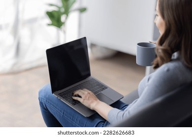 Portrait of  young happy canadian female freelancer checking email news online sitting on sofa,for friends, studying, blogging, resting and chatting online. High quality photo - Shutterstock ID 2282626683