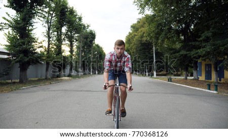 Similar – Image, Stock Photo Two men having fun riding bike and skateboard