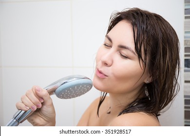 Portrait Of Young Happy Woman Singing In Shower