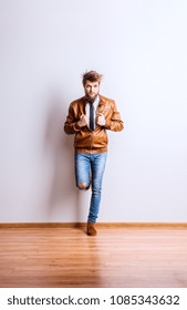 Portrait Of A Young Hipster Man In A Studio. Copy Space.