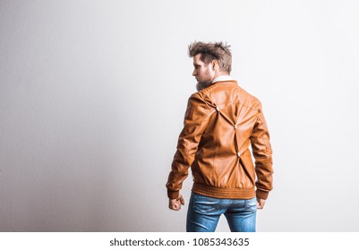 Portrait Of A Young Hipster Man In A Studio. Copy Space.