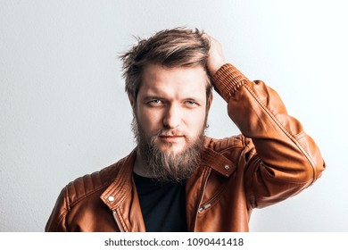 Portrait Of A Young Hipster Man In A Studio. Copy Space.