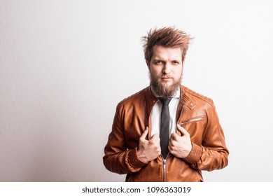 Portrait Of A Young Hipster Man In A Studio On A White Background. Copy Space.