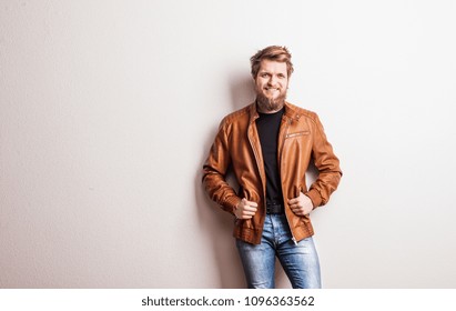 Portrait Of A Young Hipster Man In A Studio. Copy Space.