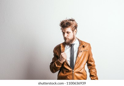 Portrait Of A Young Hipster Man In A Studio On A White Background. Copy Space.