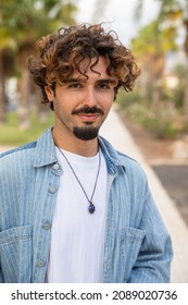 Portrait Of A Young Hispanic Boy, South European Person, Caucasian Millennial Man With Goatee And Mustache, Casual Boy