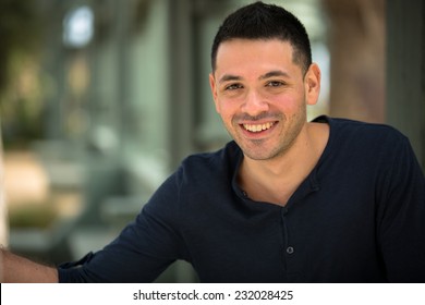 Portrait Of A Young Hispanic Male Smiling 