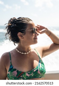 Portrait Of Young Hispanic Woman In Profile With Sunglasses On Boat