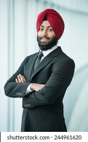 Portrait of young indian businessman in suit and turban.