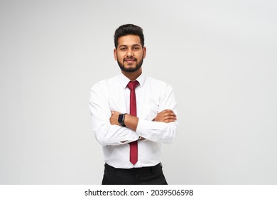 Portrait of young indian top manager in t-shirt and tie crossed arms on white isolated background