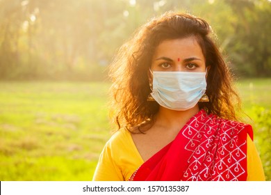 Portrait Of A Young Indian Woman Wearing Mask. The Concept Of Tourism, Health And Safety In The Asian And India Countries.