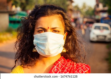 Portrait Of A Young Indian Woman Wearing Mask. The Concept Of Tourism, Health And Safety In The Asian And India Countries