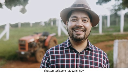 Portrait Of Young Latin Farmer Man In The Casual Shirt In The Farm On The Farm Background.