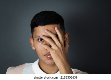 Portrait Young Latin Male Model Covering His Face With Hand