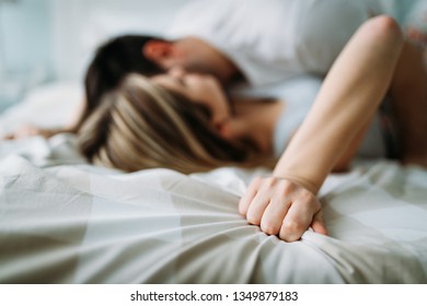 Portrait of young loving couple in bedroom - Shutterstock ID 1349879183