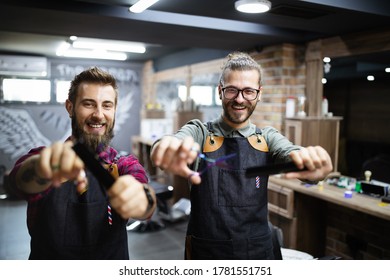 Portrait Of Young Male Barbers And Hairdressers In Barber Shop