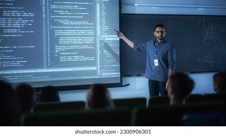 Portrait of a Young Male Teacher Giving a Data Science Lecture to Diverse Multiethnic Group of Female and Male Students in Dark College Room. Projecting Slideshow with a Neural Network Model