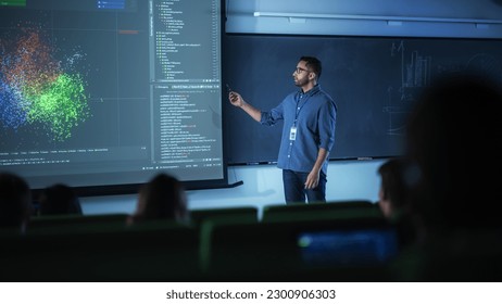 Portrait of a Young Male Teacher Giving a Data Science Lecture to Diverse Multiethnic Group of Female and Male Students in Dark College Room. Projecting Slideshow with a Neural Network Model - Powered by Shutterstock - Get 15% off with code: PIKWIZARD15
