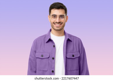 Portrait Of Young Male Teacher In Round Glasses And Casual Purple Shirt Looking At Camera, Isolated On Purple Background