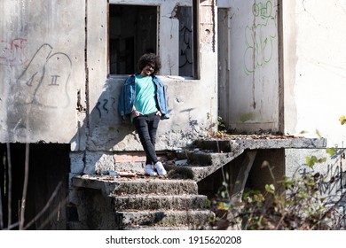 Portrait Of A Young Man Afro Hair Posing At Abandoned House Outside