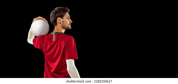 Portrait Of Young Man, Beach Volleyball Player Posing With Ball, Isolated Over Black Background. Concentration. Concept Of Sport, Action, Team Game, Active Lifestyle, Health, Hobby, Ad