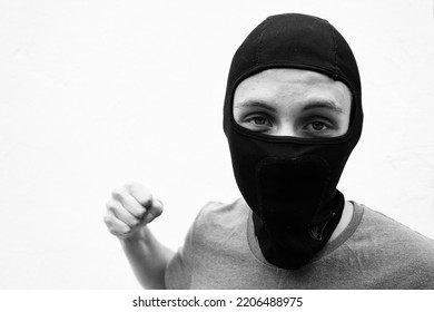 Portrait Of A Young Man In A Black Balaclava