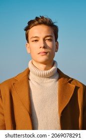 Portrait Of Young Man In Blazer And Wool Coat Outdoor